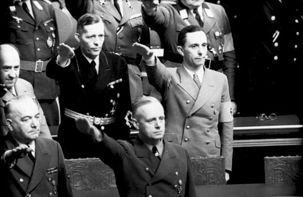 Clockwise from top left: Funk, Krosigk, Goebbels, Ribbentrop and Neurath salute at the Reichstag, 4 May 1941