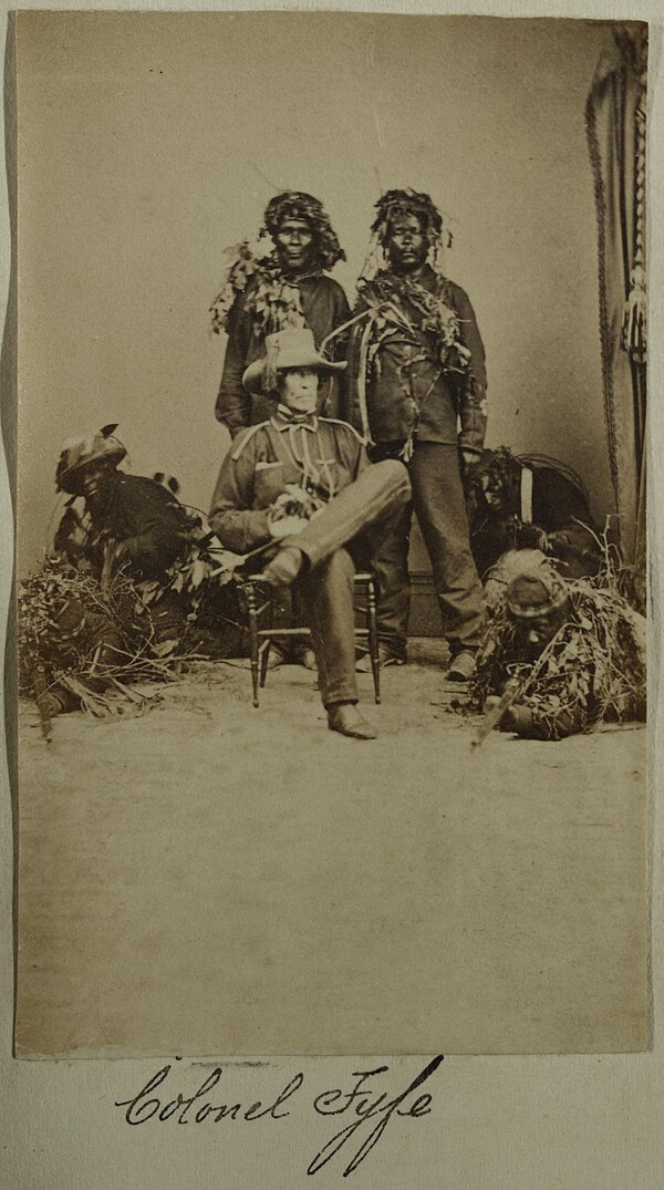Six Maroons, with rifles and in camouflage, with Colonel Fyfe, c.1865