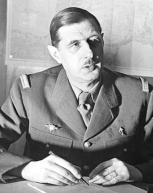 Commander of Free French Forces Charles de Gaulle seated (cropped).jpg