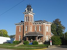 Old two-story brick house with tower