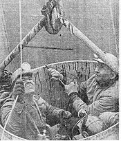 Three miners are extracted during the Farmington Mine disaster, in a bucket attached to a crane Farmington-Mine-Disaster-rescue.jpg