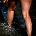 Female Legs On Beach