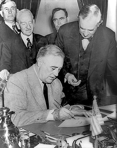 US President Franklin D. Roosevelt signs a declaration of war against Nazi Germany on December 11, 1941.