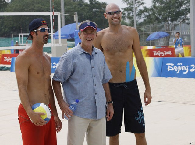 President George W. Bush pauses with Dalhausser and teammate Todd Rogers as he visited the practice session Saturday, August 9, 2008, at Beijing's Cha