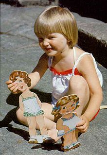 A girl playing with paper dolls Girlgenderrole3.jpg