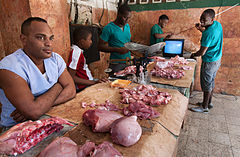 Antenna reception troubles watching a TV football match in a Meat Market. Havana (La Habana), Cuba