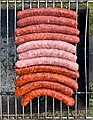 Huit merguez et trois saucisses en début de cuisson au barbecue en mars 2020.jpg