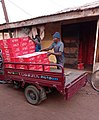 Hustlers Loading Tin Tomatoes in Tricycle 01