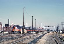 The City of New Orleans at Champaign, IL station on October 27, 1962. Illinois Central E8A 4025 (24606949091).jpg