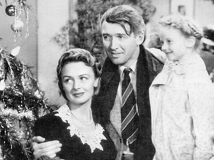 Donna Reed, Jimmy Stewart and Karolyn Grimes in the 1946 American film It's a Wonderful Life