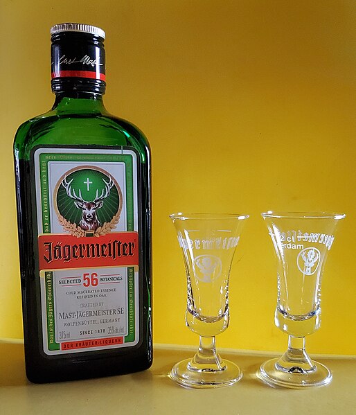 File:Jägermeister with shot glasses.jpg