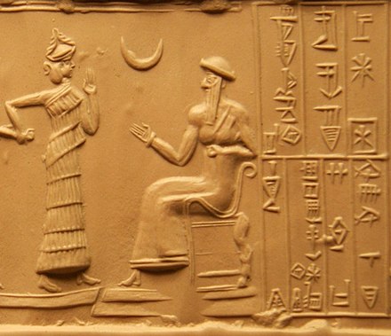 Impression of the cylinder seal of Ḫašḫamer, ensi. The seated figure is probably king Ur-Nammu, bestowing the governorship on Ḫašḫamer, who is led before him by the goddess Lamma. Nanna himself is indicated in the form of a crescent (c. 2100 BCE)