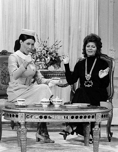 Tomlin as Mrs. Earbore (The Tasteful Lady) with Rita Hayworth on Rowan & Martin's Laugh-In (1971)