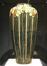Vase with long stemmed flowers