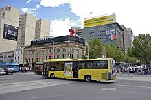 Custom Coaches bodied MAN 15.220 outside Flinders Street station in February 2008 National Bus MAN 15.220.jpg