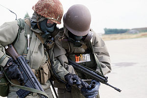 Norwegian soldiers w respirators and radio.jpg