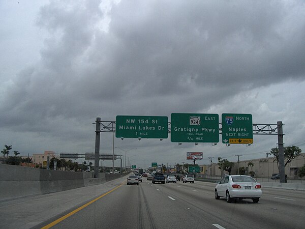 Palmetto Expressway northbound approaching the I-75/SR 924 interchange near Hialeah and Miami Lakes