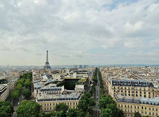 The Eiffel Tower in background with city buildings below