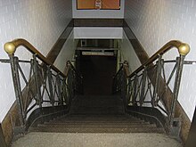 One of few remnants of the original station still in use, a staircase between tracks 3 and 4 PennsylvaniaStationNYStairs 02.JPG