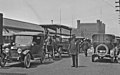 Pike Place, 1919. The North Arcade is at right. In the background is the old Washington National Guard Armory that was demolished c. 1968.