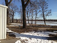 Platte river bounding the south side of Riverside Park Dance Pavilion (the southwest corner of the Pavilion can be seen on the left side of the photo) Platt River Viewed from the southside of Riverside Park Dance Pavilion 1 14 2013.JPG