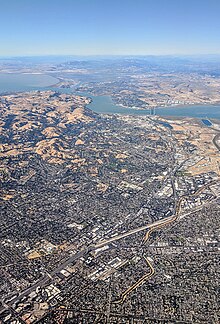 Pleasant Hill, Concord, Martinez, and Vallejo aerial looking north, with I-680, the EBMUD Trail, the Walnut Creek, and the bridges over the Carquinez Strait. I-680 roughly parallels the Walnut Creek (the orange channel) from Walnut Creek to the Carquinez Strait. Pleasant Hill Martinez aerial with EBMUD Trail and the Walnut Creek.jpg