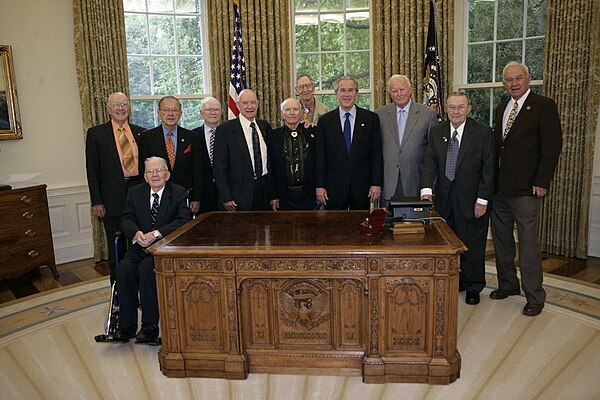 Stevens and President George W. Bush with World War II veterans of the 322nd Troop Carrier Squadron, 2006