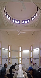 Muslims performing Wudu, the ritual of washing one's hands, arms, feet and head prior to Salat or other prayers. Qaed Ibrahim Mosque-Interior (13).jpg