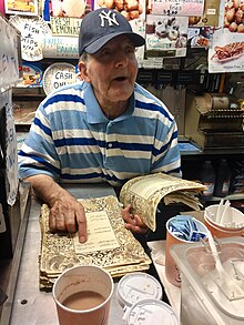 Owner Ray Alvarez, sitting behind the counter of the store. Ray Alvarez.jpg