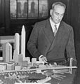 Image 4Robert Moses with a model of his proposed Battery Bridge, never built (from History of New York City (1898–1945))