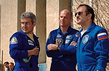 Astronauts Marcos Pontes and Jeffrey N. Williams (center), and cosmonaut Pavel V. Vinogradov, take a break from their training at the Cosmonaut Hotel in Baikonur, Kazakhstan, days before their launch on a Soyuz spacecraft. Soyuz TMA-8 crew.jpg