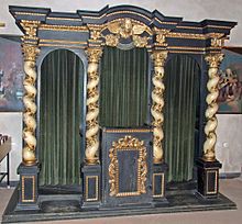 In Roman Catholic settings, the traditional style of confessional allows the priest, seated in the center, to hear from penitents on alternating sides. St.leonhard-ffm-beichtstuhl001.jpg