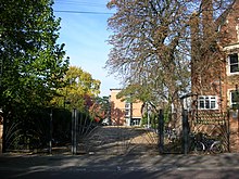 The ornamental gates at the rear of St Hugh's College, on the north side of Canterbury Road at the junction with Winchester Road. St Hugh's College, Oxford - rear gates.JPG