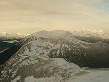 A view of the southern end of the Takshanuk Mountains. The Chilkat River can barely be glimpsed in the lower lefthand corner. TakshanukMountains1.jpg