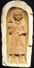 tomb stela with youth framed by niche with a round arch