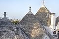 * Nomination Trulli - Alberobello, Bari, Italy - August 15, 2010 (by GiorgioGaleotti) --Sebring12Hrs 18:26, 6 May 2022 (UTC) * Promotion Good quality.Some highlights burnt in sunlit areas, but without colour shift, so acceptable. Very good sharpness, and composition. --Smial 11:29, 9 May 2022 (UTC)