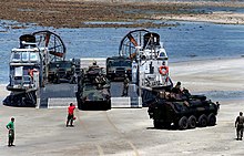 USMC LAV-25s and HMMWVs are offloaded from a USN LCAC craft at Samesan RTMB, Thailand. USMC LCAC offloading.jpg