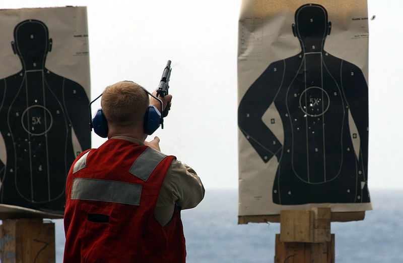 File:US Navy 041006-N-2143T-013 During small arms qualification, Chief Electronics Technician Lance Pillow of Tucson, Ariz., fires a 9mm pistol off deck edge elevator three aboard the aircraft carrier USS Nimitz (CVN 68).jpg