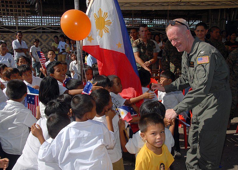 File:US Navy 070218-N-9860Y-293 Following a two-day construction project at Changco Elementary School, Capt. Michael McCarten, 7th Fleet surgeon, greets students of the school during a dedication ceremony.jpg