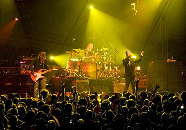 The Verve performing at Madison Square Garden in 2008. From left to right: Nick McCabe, Peter Salisbury, Richard Ashcroft and, out of sight, Simon Jon