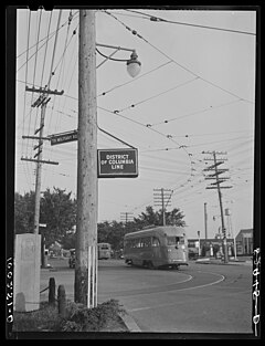 1942 photo shows two Capital Transit streetcars, one arriving at and one departing from the Friendship Heights loop on Wisconsin Avenue. Washington, D.C. District of Columbia and Maryland boundary line 8c36393v.jpg