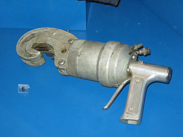 A hand-held, hydraulically powered, net cutter of the type used by X boat divers to cut through torpedo nets protecting harbours