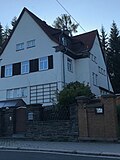 Residential house in open development with fencing