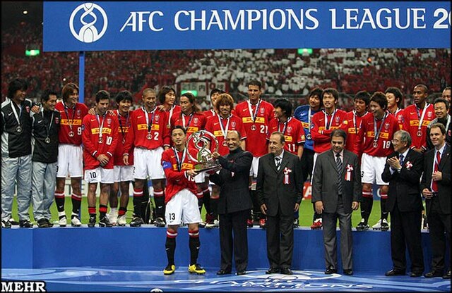 Urawa Reds players lifting the 2007 AFC Champions League trophy