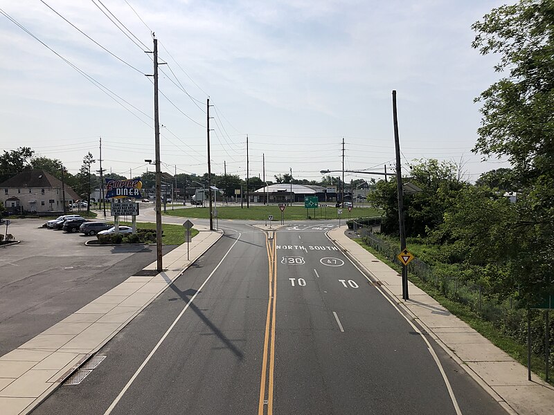 File:2021-07-15 09 41 25 View north along U.S. Route 130 and south along Camden County Route 551 from the overpass for the rail line between New Broadway and New Jersey State Route 47 (Delsea Drive) in Brooklawn, Camden County, New Jersey.jpg