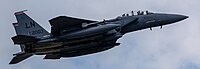 An F-15E Strike Eagle, tail number 01-2003, taking off from RAF Lakenheath in England. The aircraft is assigned to the 494th Fighter Squadron.