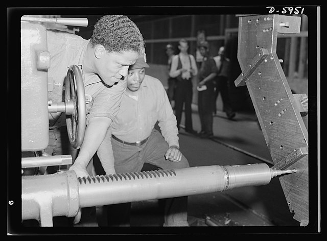 A skilled machine operator makes parts for medium tanks at the Hegewisch, Chicago, plant in 1942