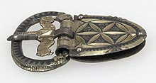 A buckle chape; this is the plate on the right. It connects the buckle to the (missing) strap. Belt Buckle MET sf17-192-146s3.jpg