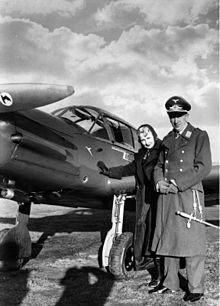 Theo Osterkamp and his wife, Fel Gudrun, with a Messerschmitt Bf 108 (1938) Bundesarchiv Bild 183-H16409, Theo Osterkamp mit Gattin, Me 108 Taifun.jpg