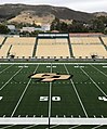 The field at Alex G. Spanos Stadium is shown on the campus of Cal Poly in June 2022, with the university's iconic hillside P visible in the background.